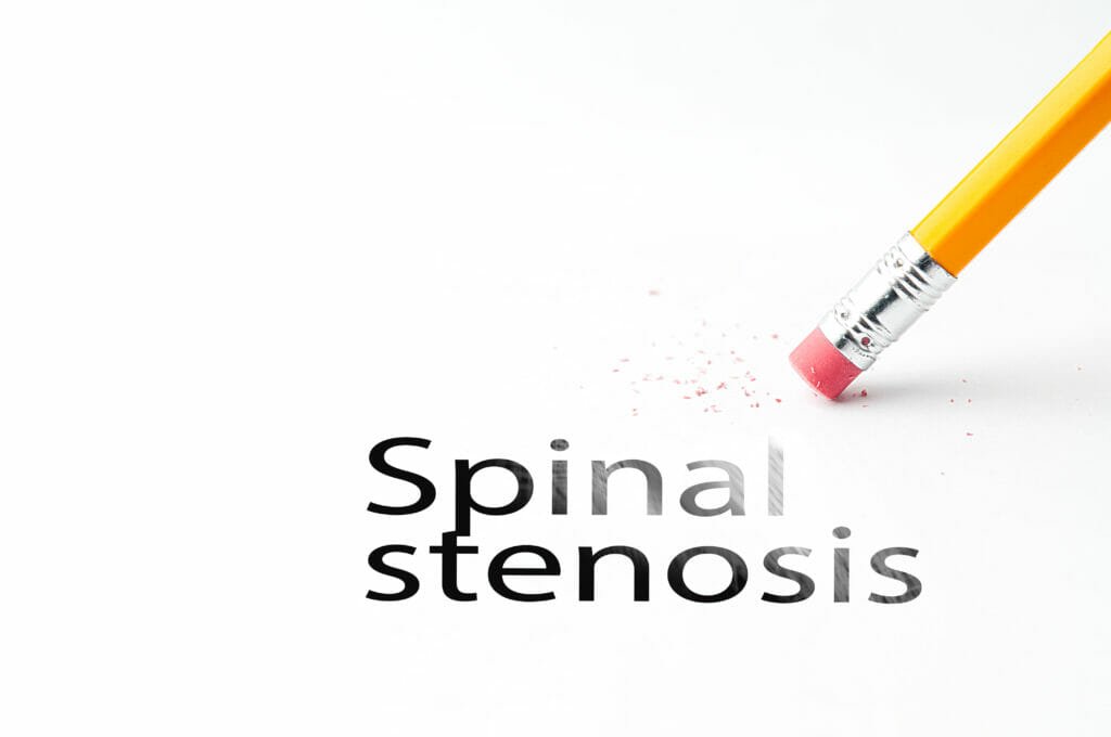 Closeup of pencil eraser and black spinal stenosis text. Spinal stenosis. Pencil with eraser.